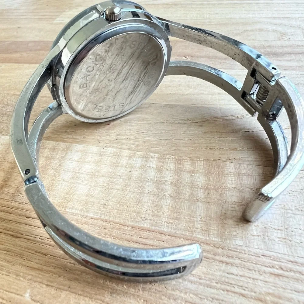 Nouveau ladies silver tone Hinged cuff fashion bracelet watch NEW BATTERY